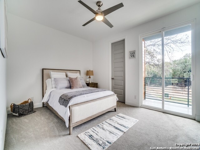 carpeted bedroom with access to exterior and ceiling fan