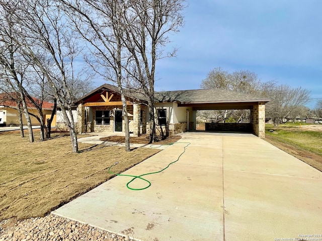 view of front of home with a carport