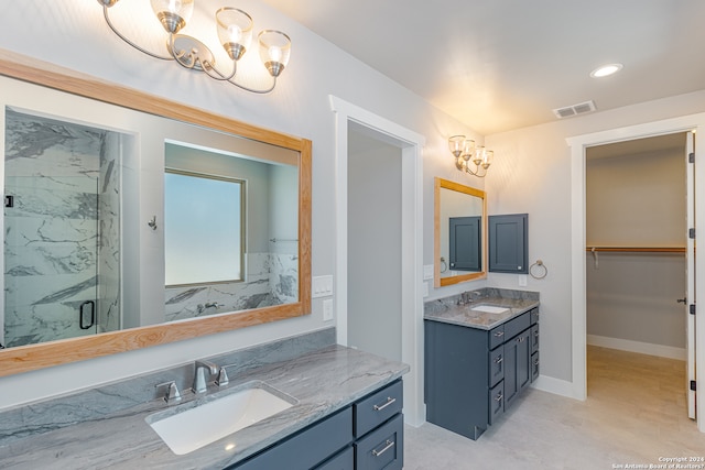 bathroom featuring vanity and an enclosed shower