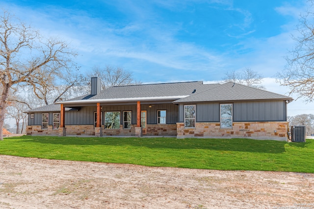 back of property featuring a lawn, covered porch, and central AC