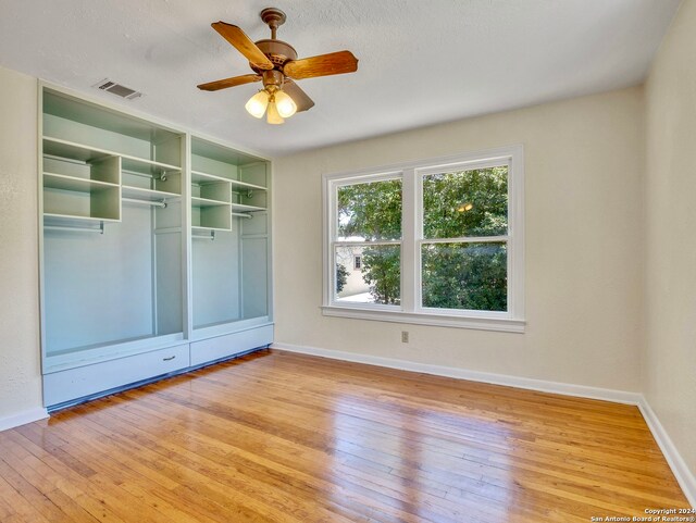 interior space with a closet, ceiling fan, and light hardwood / wood-style floors