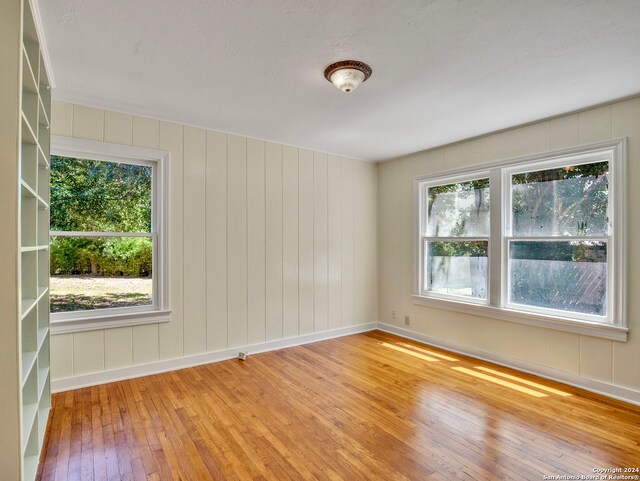 empty room with light hardwood / wood-style floors