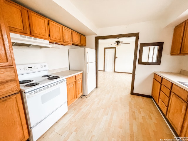 kitchen featuring ceiling fan, white appliances, and light hardwood / wood-style floors