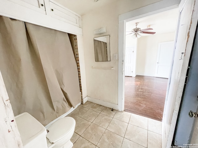 bathroom featuring ceiling fan, toilet, and hardwood / wood-style floors