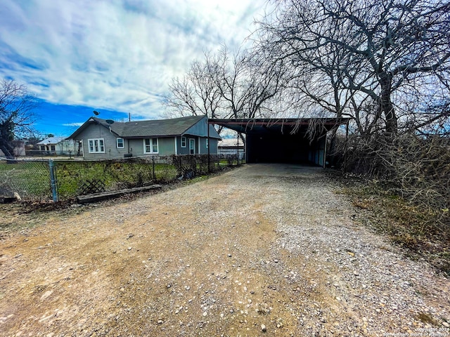 ranch-style house featuring a carport