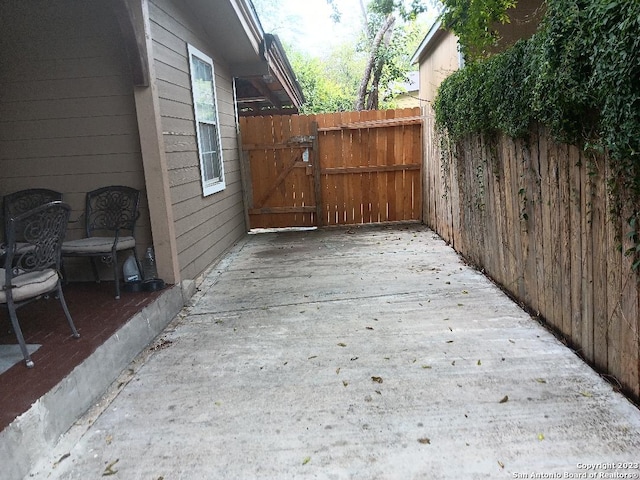 126 Lucas St, San Antonio, TX 78209 - view of patio with a gate and fence