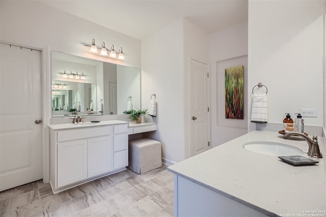 bathroom with tile flooring and vanity with extensive cabinet space