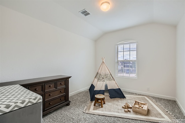 rec room with lofted ceiling and light colored carpet