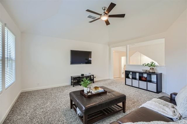 carpeted living room with ceiling fan and lofted ceiling