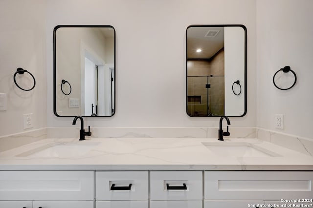 bathroom with dual bowl vanity