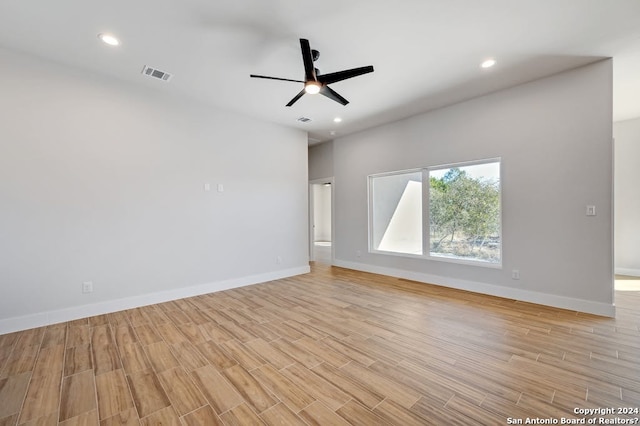 unfurnished room with ceiling fan and light hardwood / wood-style floors