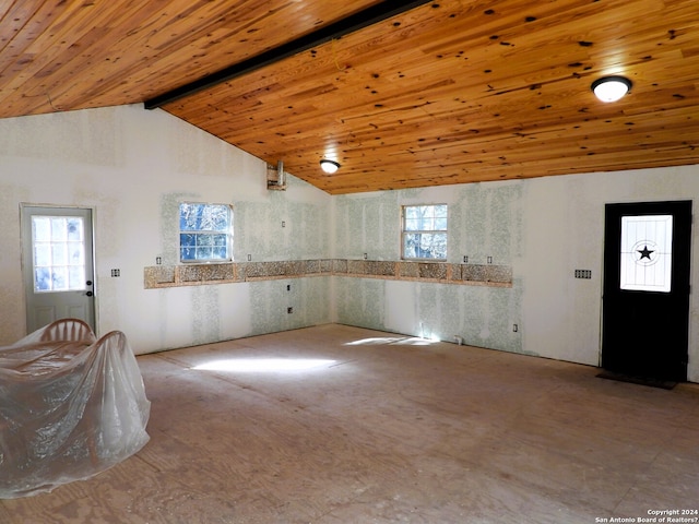 spare room featuring beam ceiling, high vaulted ceiling, and wooden ceiling