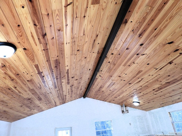 details featuring beamed ceiling and wooden ceiling