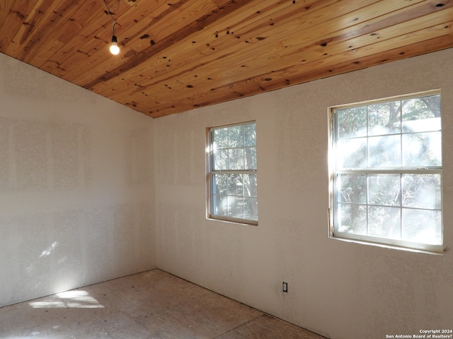 unfurnished room with wooden ceiling