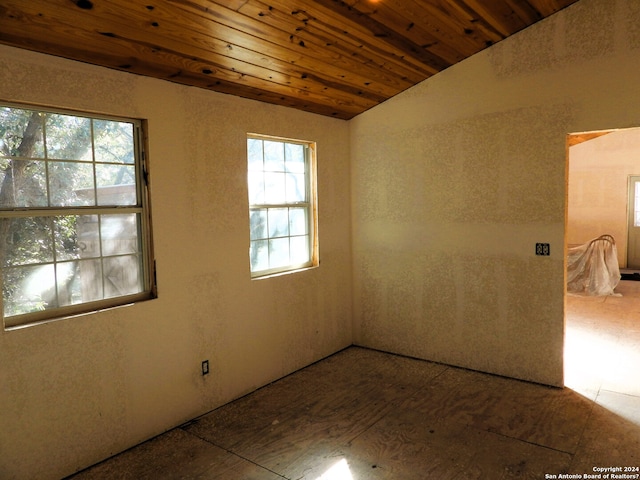 spare room with lofted ceiling and wooden ceiling