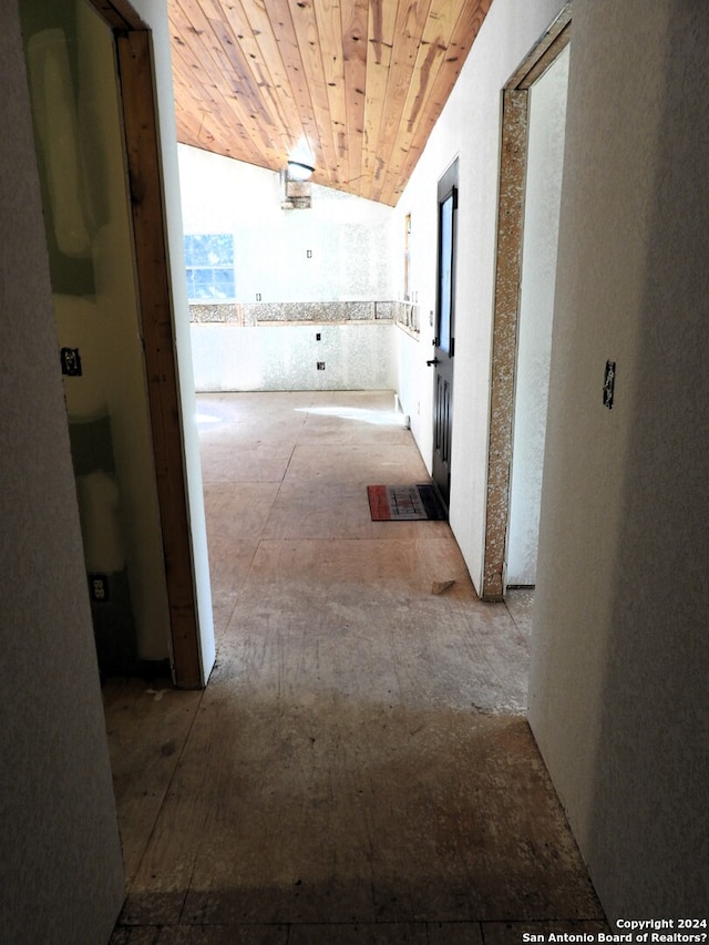 corridor featuring vaulted ceiling and wooden ceiling