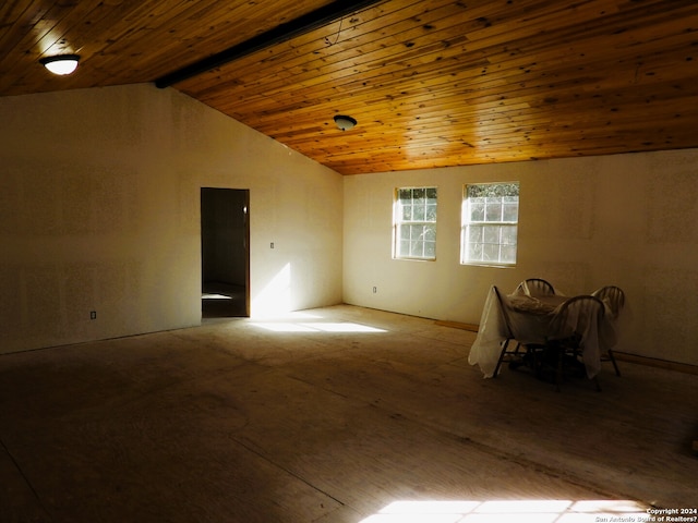 spare room with wooden ceiling and vaulted ceiling with beams