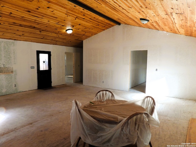 dining area featuring vaulted ceiling with beams and wooden ceiling