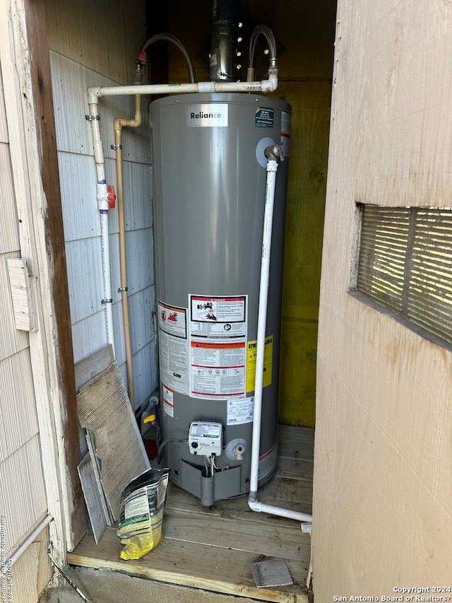 utility room with water heater