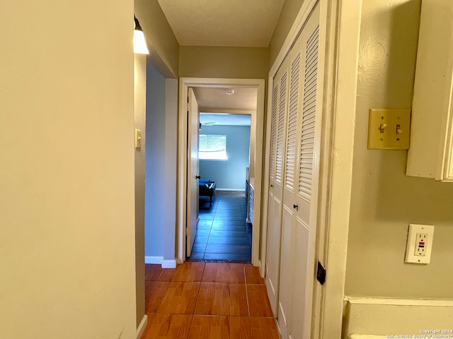 hallway with dark wood-type flooring