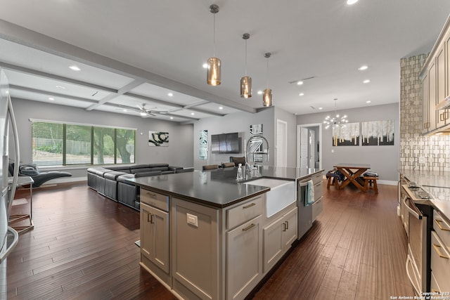 kitchen featuring decorative light fixtures, coffered ceiling, dark hardwood / wood-style floors, a center island, and ceiling fan with notable chandelier