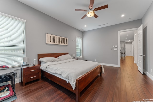 bedroom featuring dark hardwood / wood-style flooring and ceiling fan