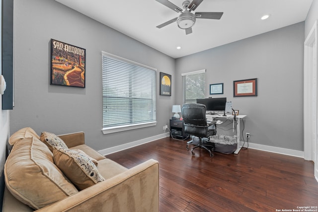 home office with ceiling fan and dark hardwood / wood-style floors