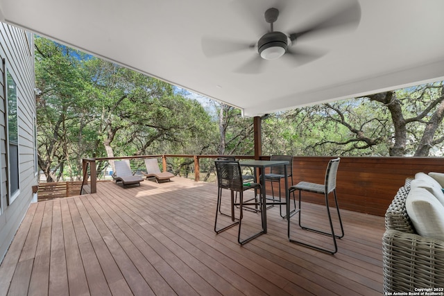 wooden terrace featuring ceiling fan