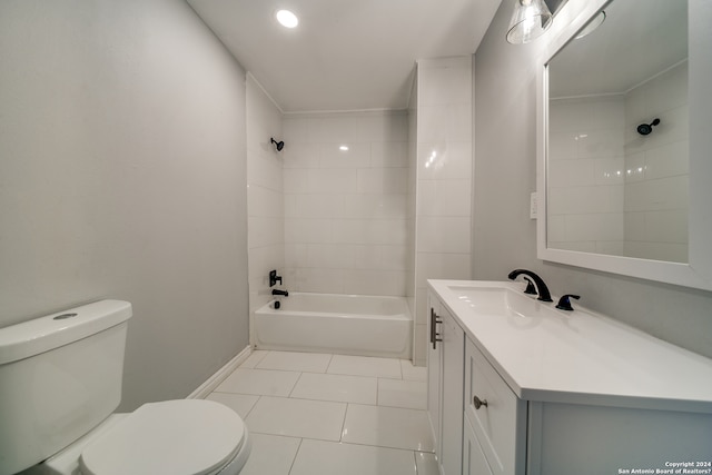 full bathroom featuring tiled shower / bath combo, tile flooring, toilet, and vanity