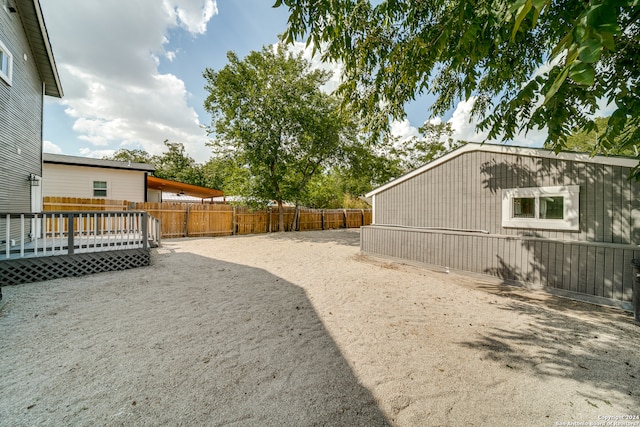 view of yard featuring a wooden deck