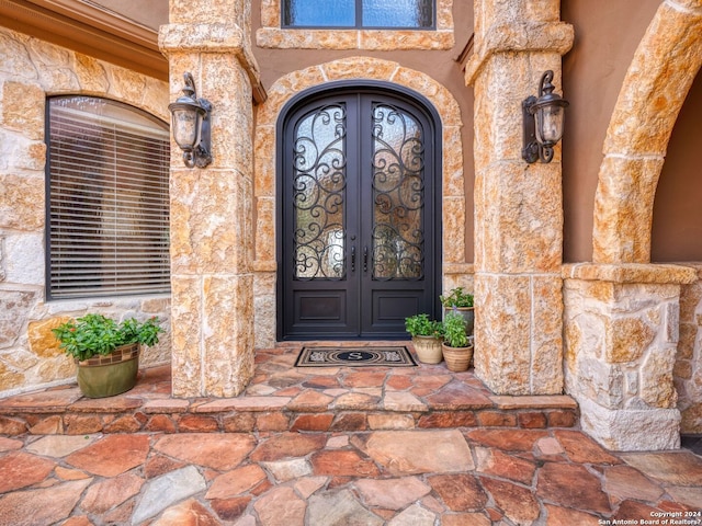 doorway to property featuring french doors