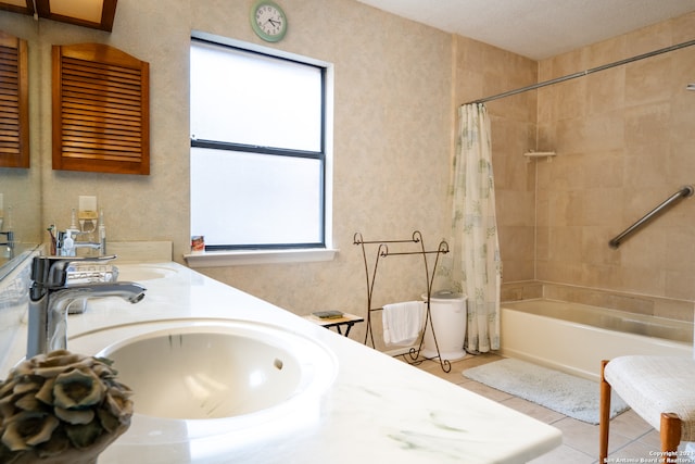 bathroom featuring shower / bath combination with curtain, a textured ceiling, tile flooring, and dual bowl vanity