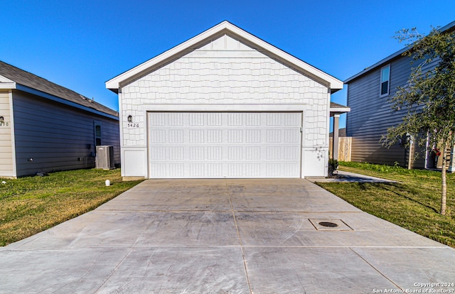 garage featuring a lawn