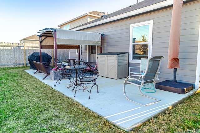 view of patio with a pergola and a grill