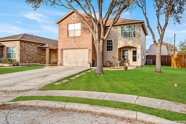 view of front property featuring a garage, central AC, and a front yard