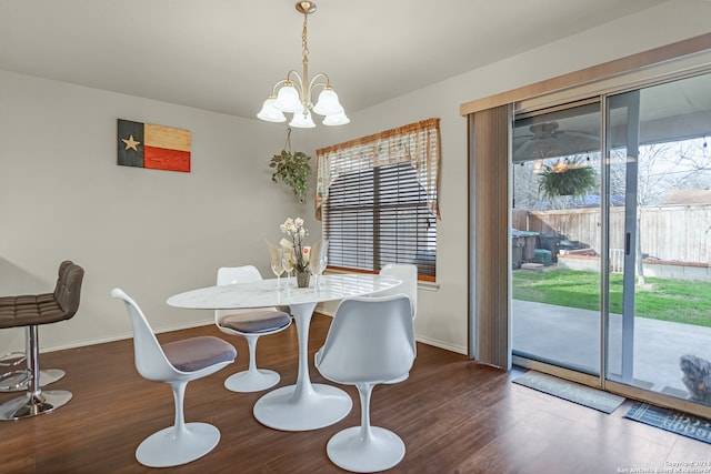 dining room featuring hardwood / wood-style floors and a chandelier