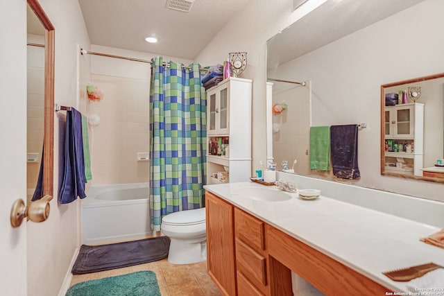 full bathroom featuring shower / bathtub combination with curtain, a textured ceiling, tile patterned floors, toilet, and vanity