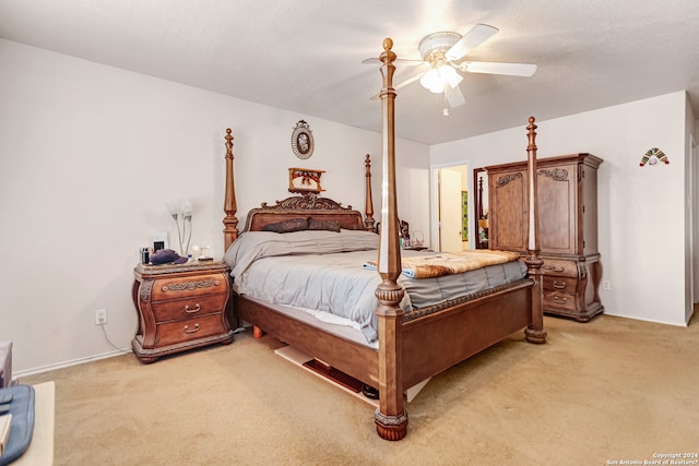 bedroom with light colored carpet and ceiling fan