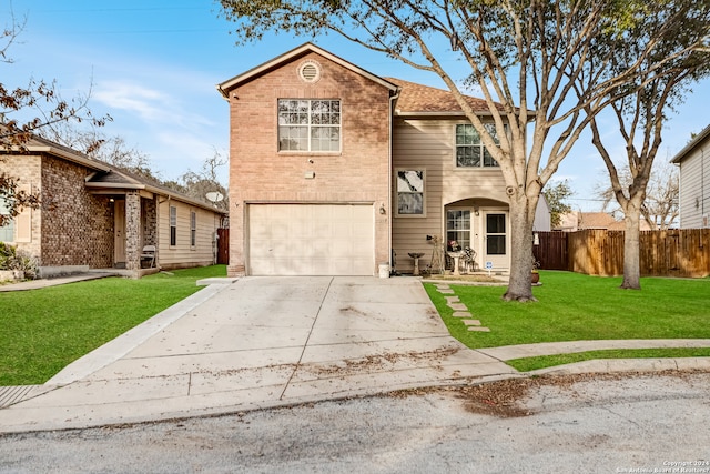 view of front property with a garage and a front yard