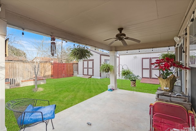 view of patio / terrace with ceiling fan and a storage unit