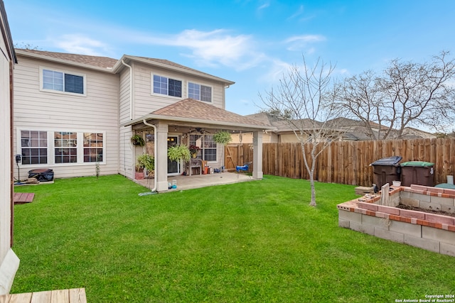 exterior space featuring a patio, ceiling fan, and a lawn