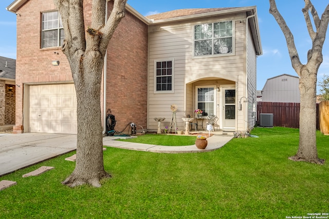 view of property with central AC unit and a front yard