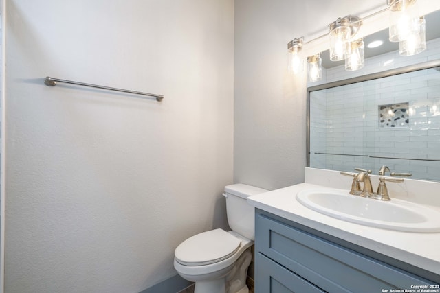 bathroom featuring oversized vanity and toilet