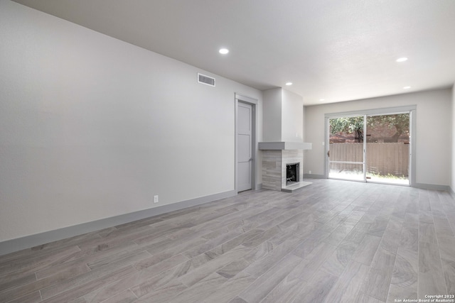 unfurnished living room featuring light hardwood / wood-style floors