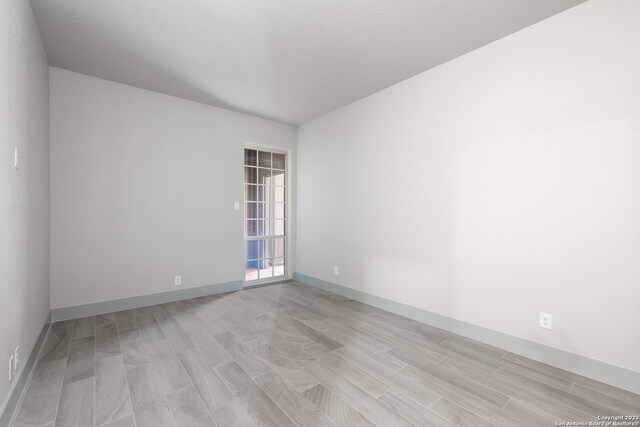 unfurnished room featuring light wood-type flooring