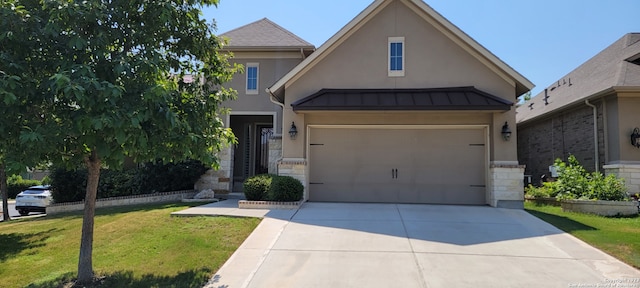 view of front of property featuring a front lawn and a garage