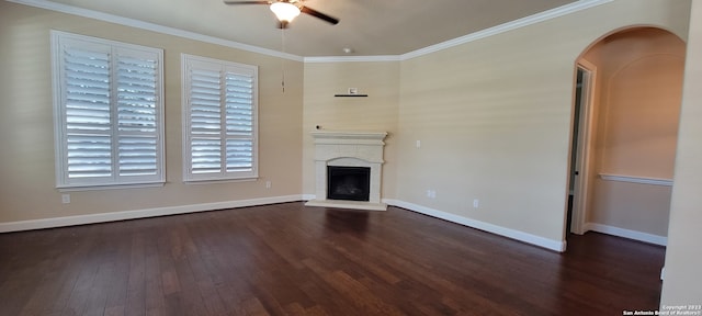 unfurnished living room with crown molding, ceiling fan, and dark hardwood / wood-style flooring