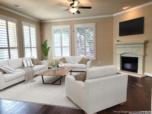 living room with dark hardwood / wood-style flooring, ceiling fan, and ornamental molding