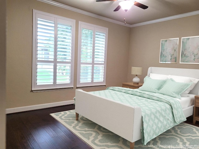 bedroom featuring dark hardwood / wood-style floors, ornamental molding, and ceiling fan