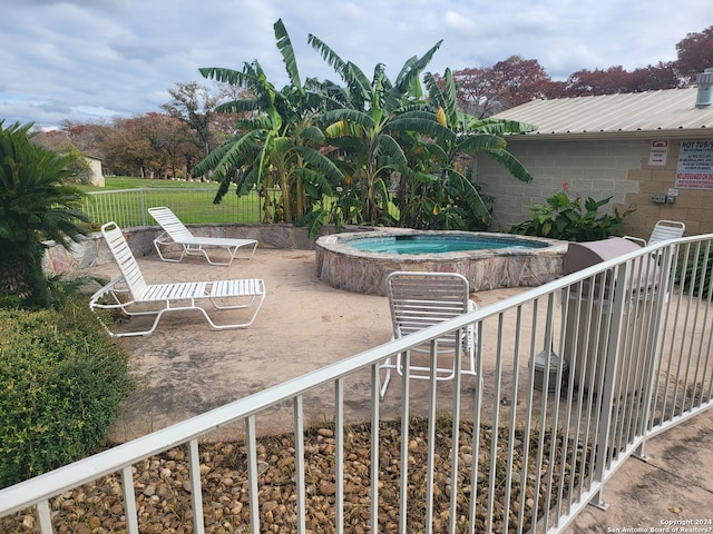 view of pool featuring a hot tub